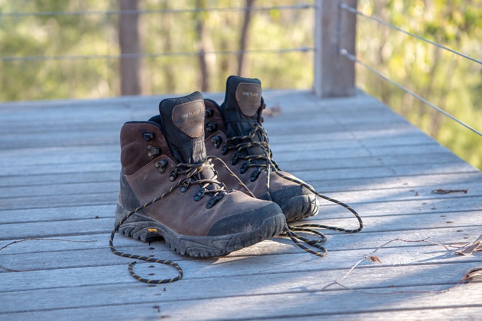 Hiking shoes on a wooden deck